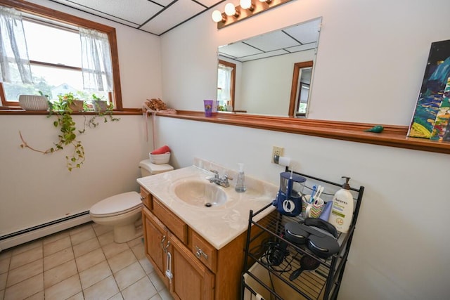 13 Evergreen Dr, Hampden, ME 04444 - half bathroom featuring vanity, tile patterned floors, plenty of natural light, and a baseboard radiator