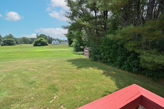 13 Evergreen Dr, Hampden, ME 04444 - view of grassy yard featuring a storage unit
