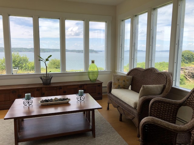 95 Main St, Lubec, ME 04652 - sunroom / solarium featuring healthy amount of natural light, a water view, and a baseboard radiator