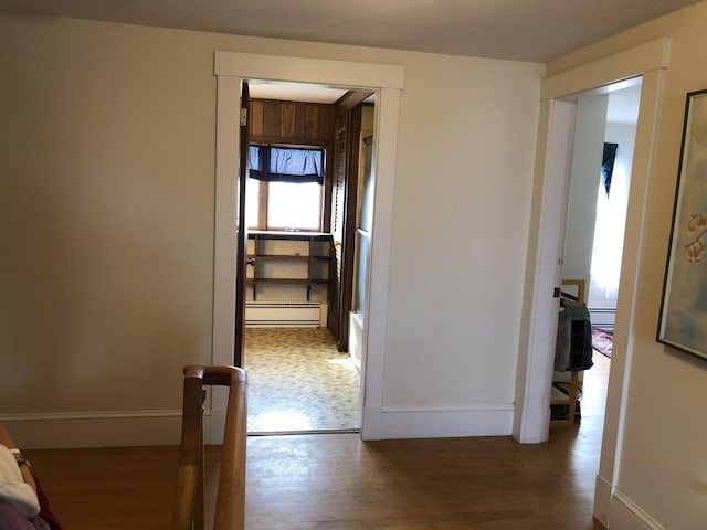 95 Main St, Lubec, ME 04652 - corridor with a baseboard radiator, wood finished floors, and baseboard heating