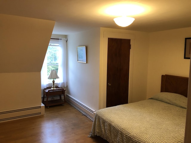 95 Main St, Lubec, ME 04652 - bedroom featuring a baseboard radiator, wood finished floors, and a closet
