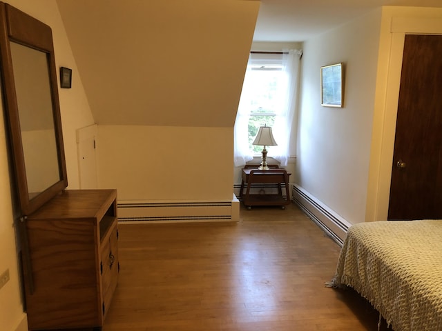 95 Main St, Lubec, ME 04652 - bedroom featuring baseboard heating and wood finished floors