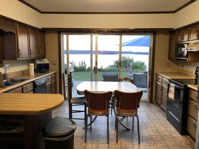 95 Main St, Lubec, ME 04652 - kitchen with black appliances, ornamental molding, dark brown cabinets, open shelves, and light countertops