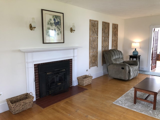 95 Main St, Lubec, ME 04652 - living area with wood finished floors and a fireplace