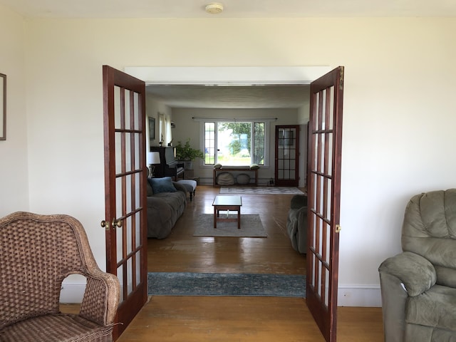 95 Main St, Lubec, ME 04652 - living room with french doors and wood finished floors