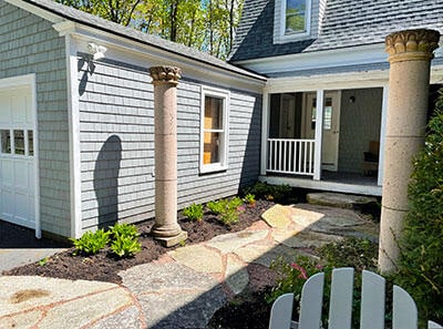18 Wayman Ln, Bar Harbor, ME 04609 - property entrance featuring a porch, a garage, and roof with shingles