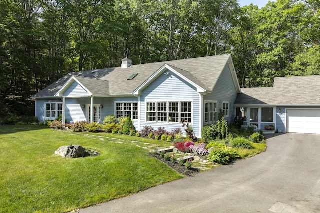 28 Evergreen Dr, Boothbay, ME 04537 - single story home with an attached garage, asphalt driveway, a front yard, a shingled roof, and a chimney
