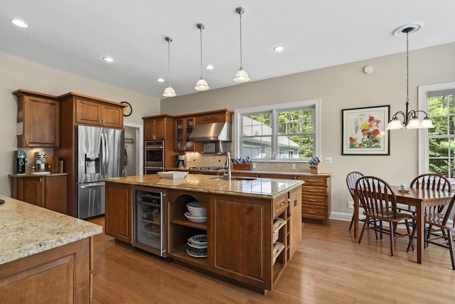28 Evergreen Dr, Boothbay, ME 04537 - kitchen with open shelves, wine cooler, stainless steel appliances, wall chimney exhaust hood, and decorative backsplash