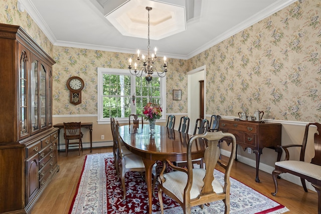 28 Evergreen Dr, Boothbay, ME 04537 - dining space featuring a baseboard heating unit, a chandelier, light wood-style floors, ornamental molding, and a wainscoted wall