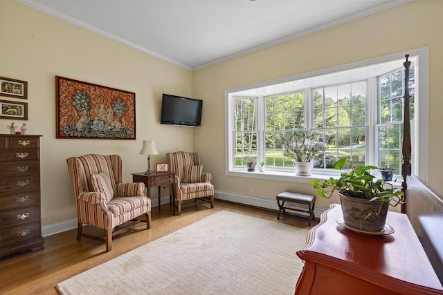 28 Evergreen Dr, Boothbay, ME 04537 - living area with healthy amount of natural light, crown molding, and wood finished floors