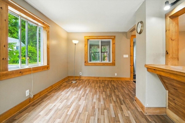90 Newbury St, Auburn, ME 04210 - unfurnished living room with plenty of natural light and wood finished floors