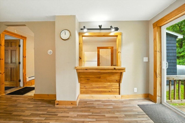 90 Newbury St, Auburn, ME 04210 - living room featuring wood finished floors and a baseboard radiator