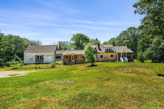 276 W St, Biddeford, ME 04005 - view of front facade with a front lawn, a chimney, and entry steps