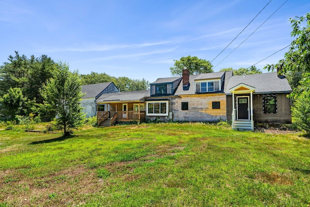 276 W St, Biddeford, ME 04005 - shingle-style home featuring a front lawn, a chimney, stone siding, and a wooden deck