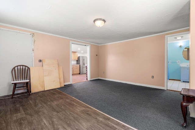 276 W St, Biddeford, ME 04005 - empty room with wood finished floors and crown molding