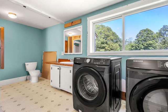 276 W St, Biddeford, ME 04005 - laundry area with independent washer and dryer and baseboards