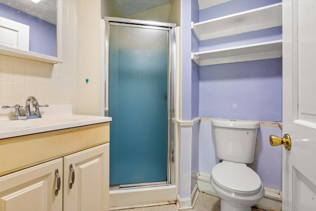 276 W St, Biddeford, ME 04005 - full bathroom featuring tile walls, vanity, a shower stall, and wainscoting