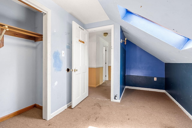 276 W St, Biddeford, ME 04005 - additional living space featuring a skylight, carpet floors, and vaulted ceiling