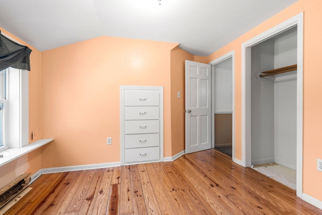 276 W St, Biddeford, ME 04005 - unfurnished bedroom featuring light wood-style flooring and a closet