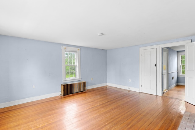 53 Saw Mill Hl, Berwick, ME 03901 - spare room with radiator heating unit, light wood finished floors, and plenty of natural light