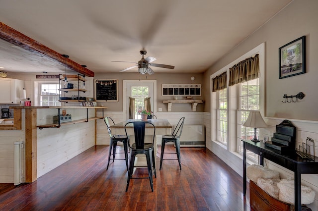 178 Kennebago Rd, Coplin Plt, ME 04970 - dining space with plenty of natural light, a wainscoted wall, dark wood-style floors, and ceiling fan