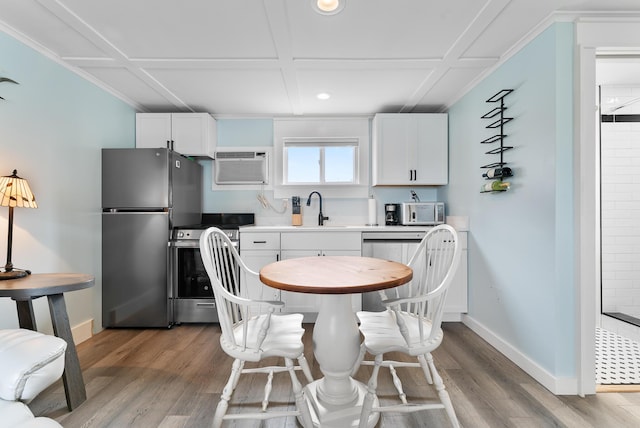 7 Bay Ave Unit 11, Old Orchard Beach, ME 04064 - dining space with a wall mounted air conditioner, wood finished floors, and recessed lighting