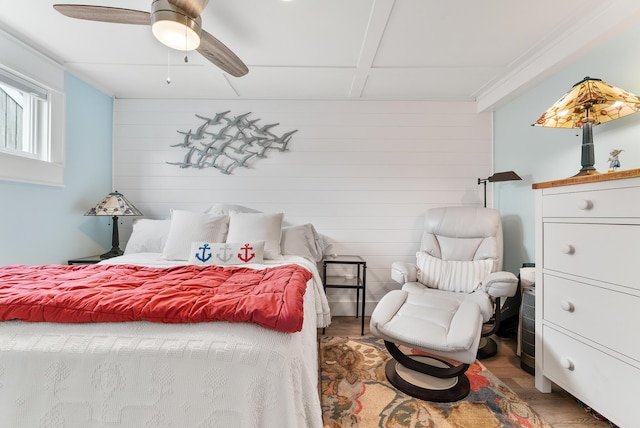 7 Bay Ave Unit 11, Old Orchard Beach, ME 04064 - bedroom with wood finished floors, a ceiling fan, and wood walls