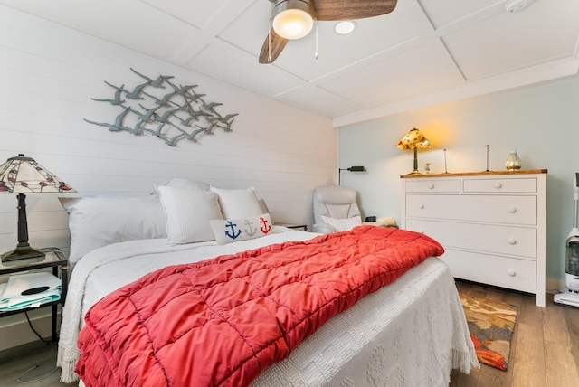 7 Bay Ave Unit 11, Old Orchard Beach, ME 04064 - bedroom with wood finished floors, ceiling fan, and wooden walls