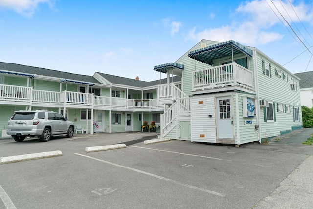 7 Bay Ave Unit 11, Old Orchard Beach, ME 04064 - view of property with uncovered parking and stairs