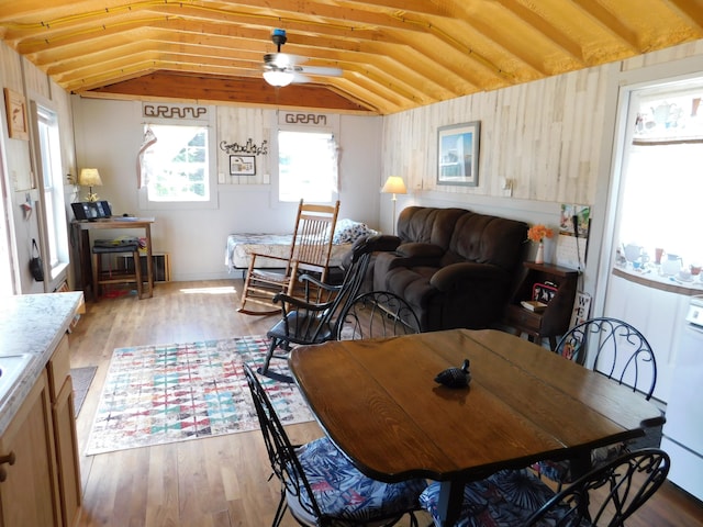 208 Fern Rd, Dexter, ME 04930 - dining room featuring vaulted ceiling, light wood finished floors, and a ceiling fan