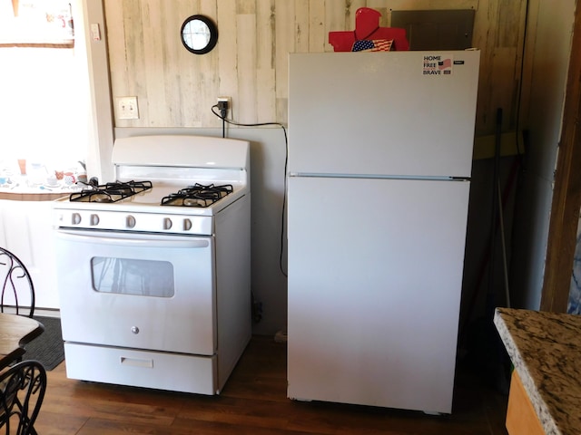 208 Fern Rd, Dexter, ME 04930 - kitchen featuring white appliances and dark wood-style flooring