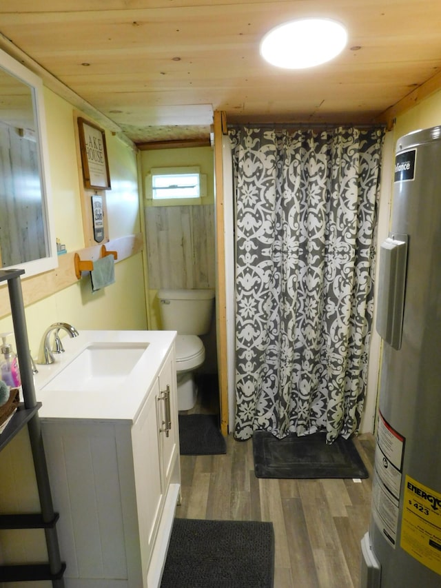 208 Fern Rd, Dexter, ME 04930 - full bath with water heater, vanity, wood finished floors, wooden ceiling, and a shower with shower curtain