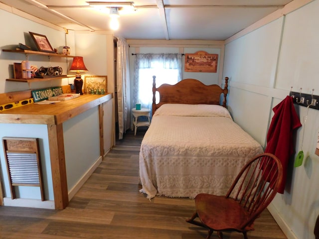 208 Fern Rd, Dexter, ME 04930 - bedroom with dark wood-style flooring