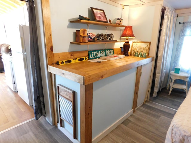 208 Fern Rd, Dexter, ME 04930 - bar area with wood finished floors and freestanding refrigerator