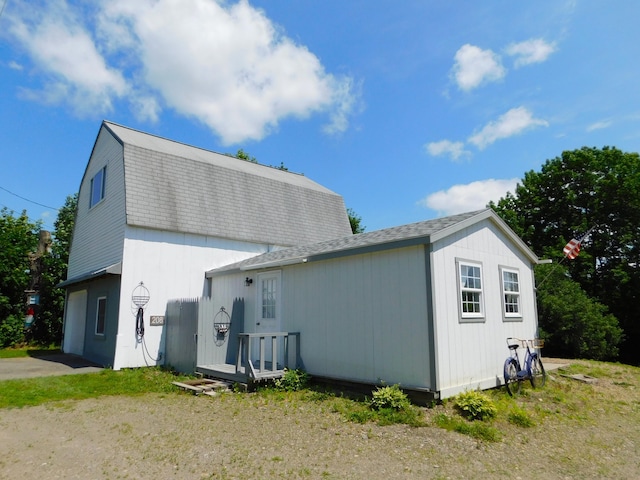 208 Fern Rd, Dexter, ME 04930 - back of property featuring a shingled roof and a gambrel roof
