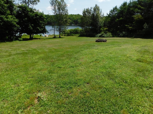 208 Fern Rd, Dexter, ME 04930 - view of green lawn featuring a water view