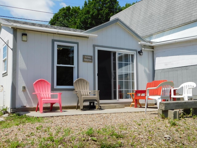 208 Fern Rd, Dexter, ME 04930 - rear view of property with a shingled roof and a patio area
