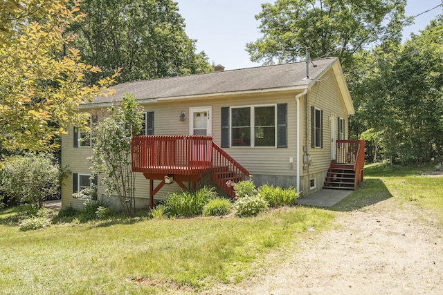 102 Mountain View Rd, Leeds, ME 04263 - view of front facade featuring a wooden deck, a front lawn, and a chimney