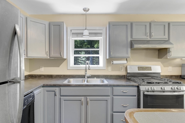 102 Mountain View Rd, Leeds, ME 04263 - kitchen with freestanding refrigerator, stainless steel gas range oven, range hood, and gray cabinetry