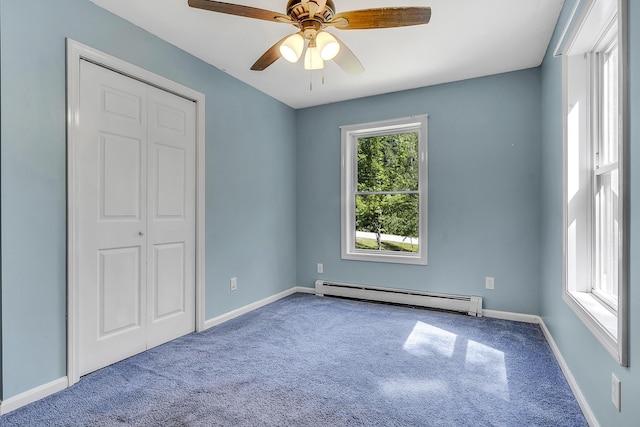102 Mountain View Rd, Leeds, ME 04263 - unfurnished bedroom featuring a baseboard radiator, carpet flooring, a closet, and ceiling fan
