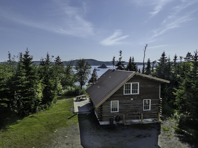 69 Jims Head Rd, Lubec, ME 04652 - view of side of home with a metal roof and a mountain view