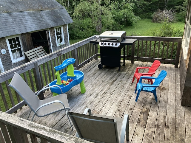 363 Oak Point Rd, Trenton, ME 04605 - wooden deck featuring area for grilling, a lawn, and an outdoor structure