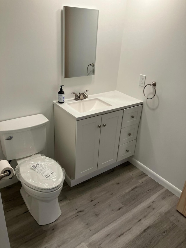 363 Oak Point Rd, Trenton, ME 04605 - bathroom featuring vanity and wood finished floors