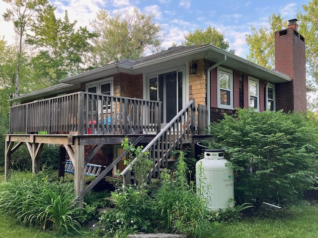 363 Oak Point Rd, Trenton, ME 04605 - view of front of home featuring a wooden deck and a chimney