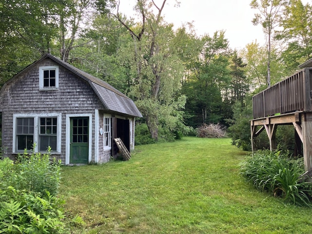 363 Oak Point Rd, Trenton, ME 04605 - view of green lawn featuring an outbuilding and a deck