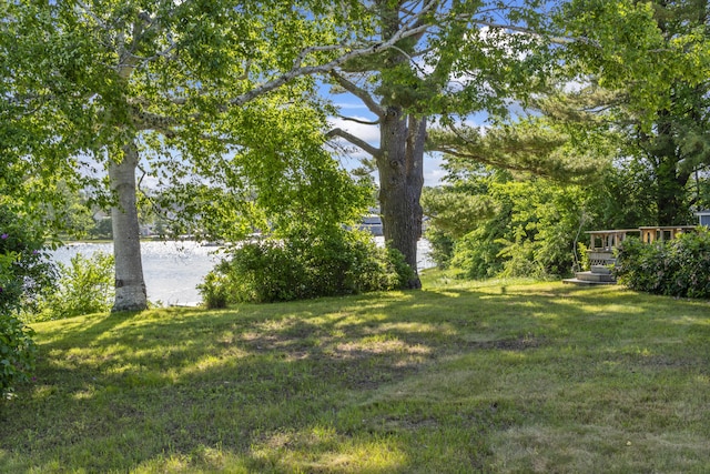 16 Christensen Ln, Kennebunk, ME 04043 - view of grassy yard with a deck with water view