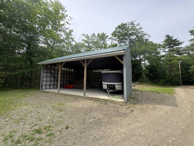 71 Garland Rd, Dixmont, ME 04932 - view of parking / parking lot with an outbuilding