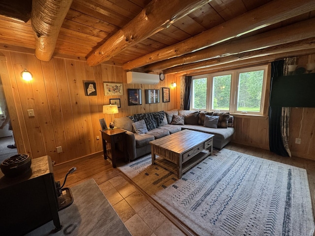 71 Garland Rd, Dixmont, ME 04932 - living area with a wall mounted AC, a wood ceiling with exposed beams, wooden walls, and tile patterned floors