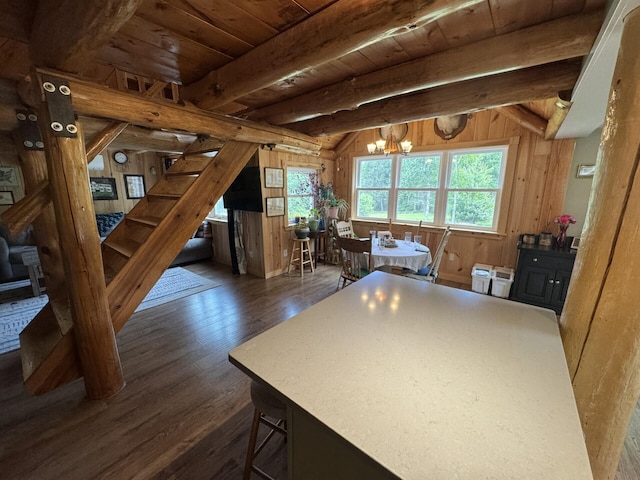 71 Garland Rd, Dixmont, ME 04932 - kitchen with wood walls, wood finished floors, wooden ceiling, a chandelier, and a kitchen island