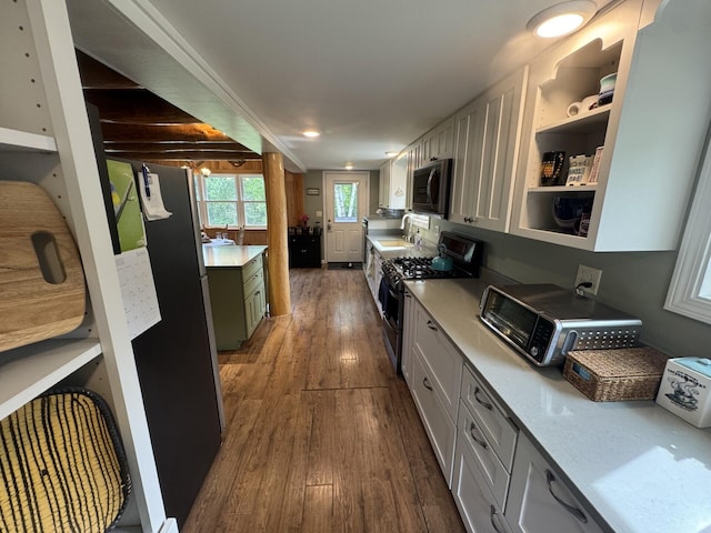 71 Garland Rd, Dixmont, ME 04932 - kitchen featuring appliances with stainless steel finishes, dark wood-style floors, light countertops, and open shelves